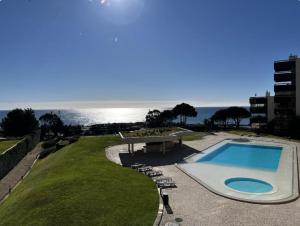 Seaside one bedroom apartment with terraces, garage & swimming pool