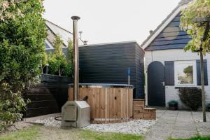 Vakantiehuisje met ruime tuin en hottub