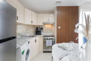 Balcony Offering Captivating Lake Views 1BR, Just a Hop from the Golf Course, Lakeside B, Dubai Production City by Deluxe Holiday Homes