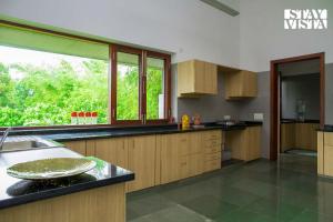 Jay House by StayVista - Leisure oasis with pool, snooker, table tennis & foosball fun