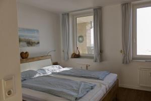 Inselblume 16 - Ferienwohnung mit Meerblick in der Strandburg B2.6