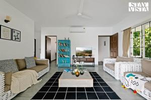 StayVista at Di Mora by the Sea with Lawn & Pool