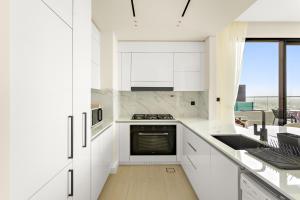 VayK - Stylish 2BR in JVC with Private Pool
