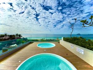 Apto em condomínio Pé na areia 3 Quartos Cozinha Completa Sacada com Churrasqueira Vaga de Garagem Piscina borda infinita Academia Quadra de esportes Sala de Jogos Summer Home Club acesso direto a praia