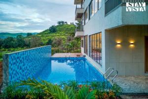 StayVista at Mount Bliss with Mountain Views, AC, WiFi