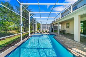 Spacious 8-Bedroom Retreat with Private Pool near Orlando Attractions