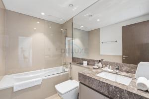 Steps from Dubai Mall and Burj Khalifa, with Seamless Metro Access to Dubai Marina and Palm Jumeirah - Act One Act Two Tower 1, Downtown Dubai by Deluxe Holiday Homes