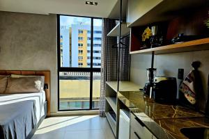 Flat a 50m da praia, com cozinha completa, estacionamento, recepção 24h, academia, lavanderia, Wi-Fi, mini mercado, Rooftop com piscina, churrasqueira e vista incrível