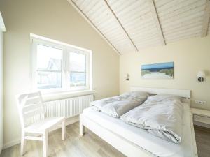 Brandgans 40 - Komfort-Ferienhaus mit eingezäuntem Garten, Sauna & Kamin