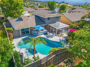 Charming Villa with Backyard Oasis Close to Beach