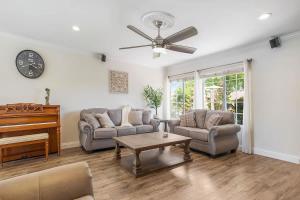 Charming Villa with Backyard Oasis Close to Beach