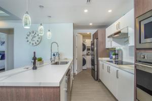 Relax in this modern ocean front condo Encantame E1404