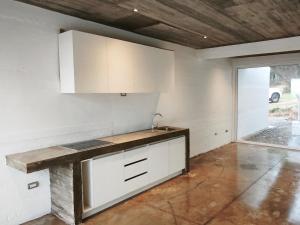 Concrete house overlooking the ocean and beach access