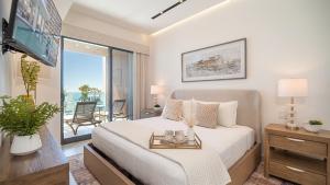 R202: Stylish 1-Bedroom Condo with Private Balcony, King Bedroom, and Relaxing Ocean Views