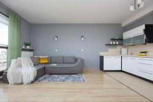 Grey Apartment in Warsaw with City View and Balcony by Noclegi Renters