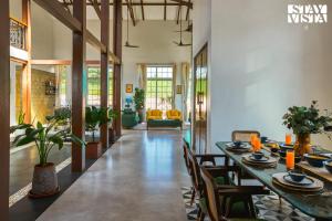 StayVistas Rustique Radiance - Hillside Retreat with Outdoor Pool & South Indian Architecture