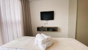 Flat Novinho e impecável com garagem Wi-Fi Self Check in área de Lazer com vista linda