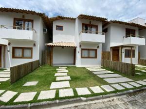 Casa Praiana com Piscina Privativa.