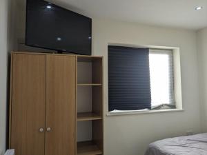 Private guest suite inside a family home with own entrance, kitchen, and bathroom