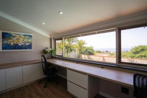 Spacious 4-Bedroom Coastal Haven with Sea Views