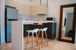 Bright 2BR Amira District Gem with Shared Pool
