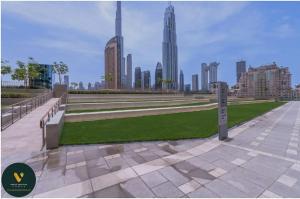 Vogue Vacation Homes, Downtown Views II with Direct Access to Dubai Mall Via a Climate Controlled Bridge, One Bedroom Apartment with Balcony and City View