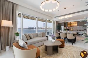 Vogue Vacation Homes, Emaar Beachfront Grand Bleu Designed by Elie Saab, near JBR and Palm Jumeirah, Two Bedroom Apartment with Balcony and Private Beach, Access toAmenities