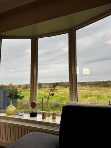 Breskens Chalet DuneView mit Zaun Haus Nr H195