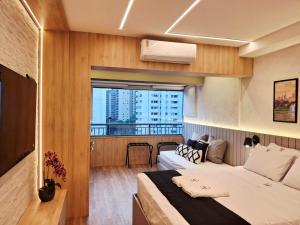 Lindo e espaçoso studio com cama queen e cama solteiro