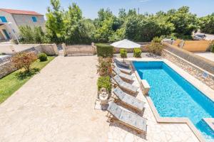 Villa with heated pool, waterfall, sandy beach - by TRAVELER tourist agency Krk - ID 2170