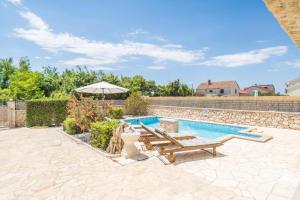 Villa with heated pool, waterfall, sandy beach - by TRAVELER tourist agency Krk - ID 2170