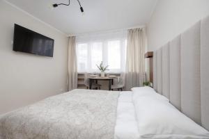 A Unique Studio with a Beautiful View of the Palace of Culture and Science by Noclegi Renters