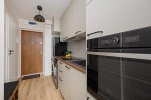 A Unique Studio with a Beautiful View of the Palace of Culture and Science by Noclegi Renters