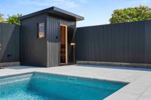 Luxe 4BR Retreat with Heated Pool & Finnish Sauna, Steps to the Beach