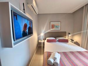 Book Santos Unique 909 com 2 dormitórios para família