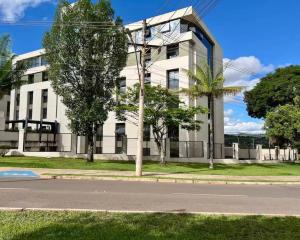 Flat aconchegante - Perto de Tudo - Vista Livre - Estacionamento privativo e Portaria 24h - Wi-Fi 600mbps