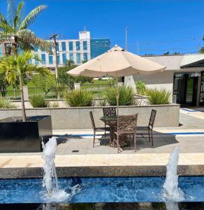 Flat aconchegante - Perto de Tudo - Vista Livre - Estacionamento privativo e Portaria 24h - Wi-Fi 600mbps