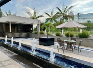 Flat aconchegante - Perto de Tudo - Vista Livre - Estacionamento privativo e Portaria 24h - Wi-Fi 600mbps