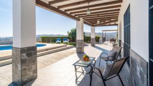 Casa Adrian Almachar by Ruralidays