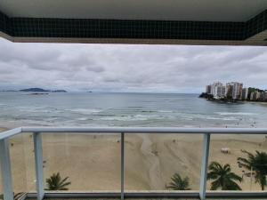 Praia pe na áreia com garagem e suite