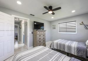 Waterfront 3BR Pool Oasis with Dock, Grill & Lounge