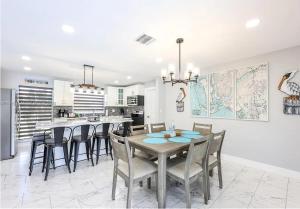 Waterfront 3BR Pool Oasis with Dock, Grill & Lounge