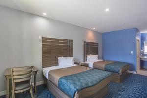 Queen Room with Two Queen Beds - Non-Smoking room in Rodeway Inn & Suites Houston - I-45 North near Spring