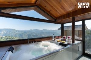 StayVista at Chestnut Manor with Sky Jacuzzi & Steam Room