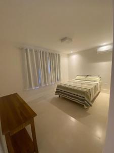 Casa com 4 suítes perto da praia