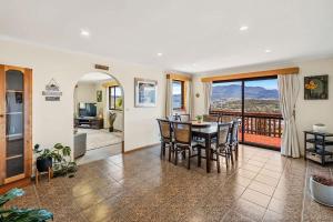 The Lookout with City water and Mountain views