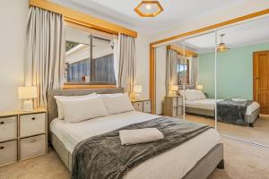 The Lookout with City water and Mountain views