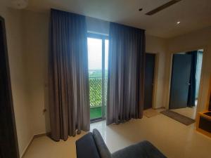 Cozy 1BHK High-Rise near ECR Balcony View Fully AC Family Friendly