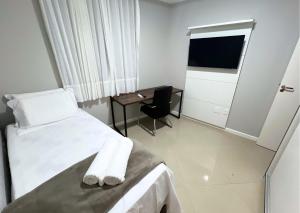 RefugioBacutia- Prédio FRENTE MAR Bacutia- 6 pessoas- 3 Quartos com AR sendo 1 suite - varanda- sala de estar e jantar Ampla -Piscina e Sauna no Prédio