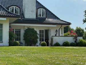 Manor House Overlooking Fields And Garden